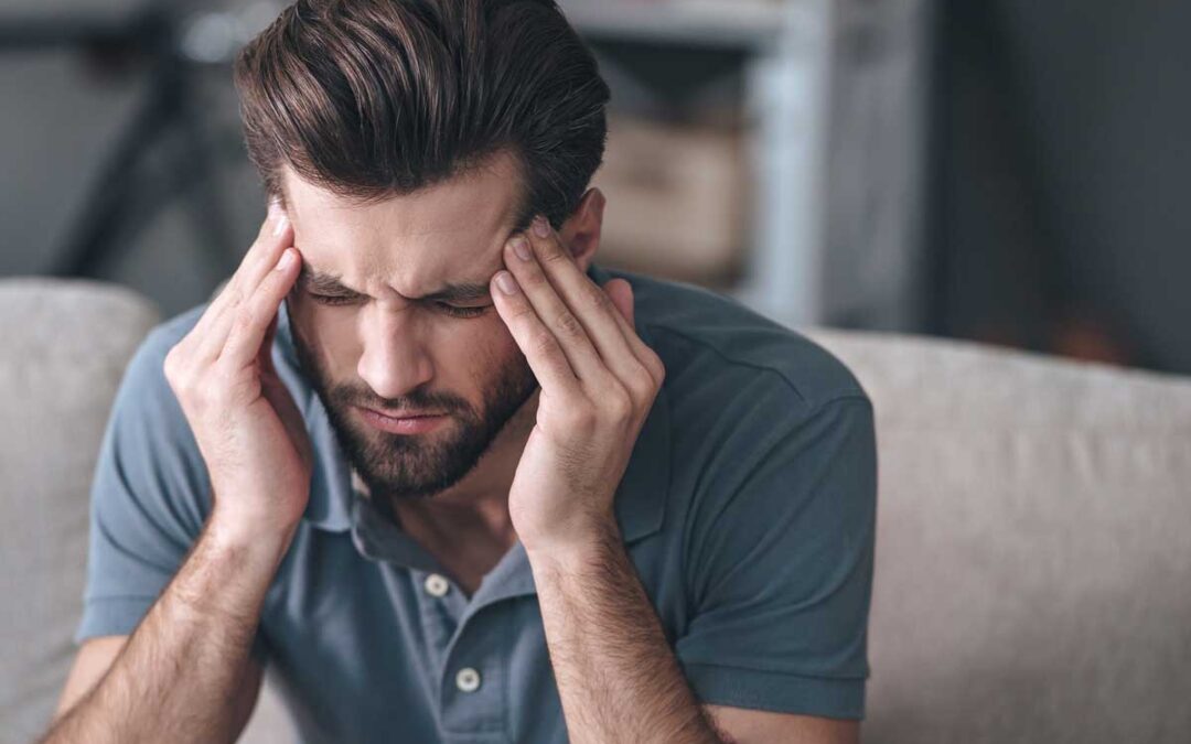 Man rubbing his temples